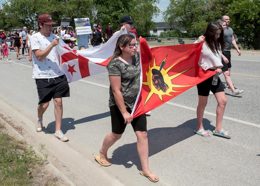 People walk to honour Rodney Levi in Red Bank, New Brunswick on Friday June 19, 2020. Indigenous leaders in New Brunswick are renewing a call for an independent, Indigenous-led public inquiry to investigate systemic racism and two recent police shootings in the province.