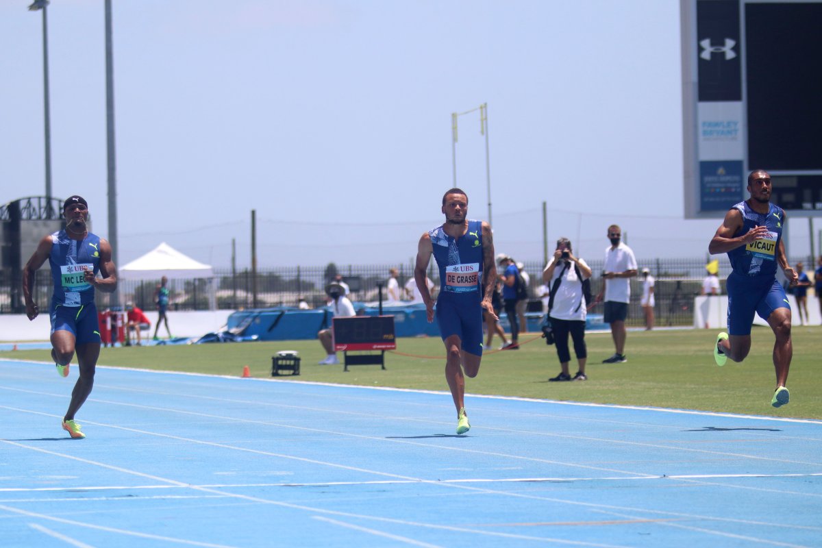 Canadian sprinter Andre de Grasse crosses the finish line in the 100-yard dash of the Inspiration Games.