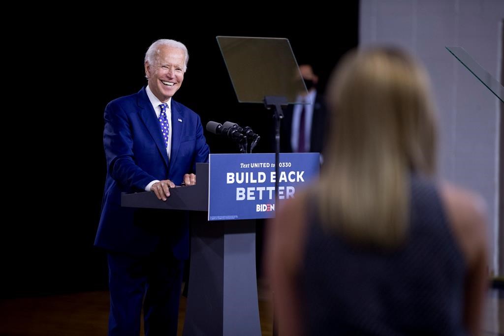 Democratic presidential candidate former Vice President Joe Biden smiles as he takes a question from a reporter at a campaign event at the William "Hicks" Anderson Community Center in Wilmington, Del., Tuesday, July 28, 2020.