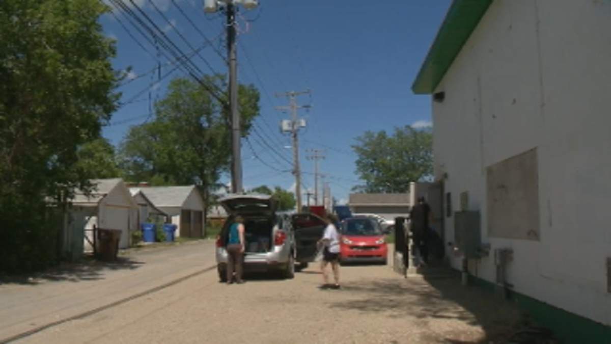 A woman drops off a donation at Carmichael Outreach on Monday.