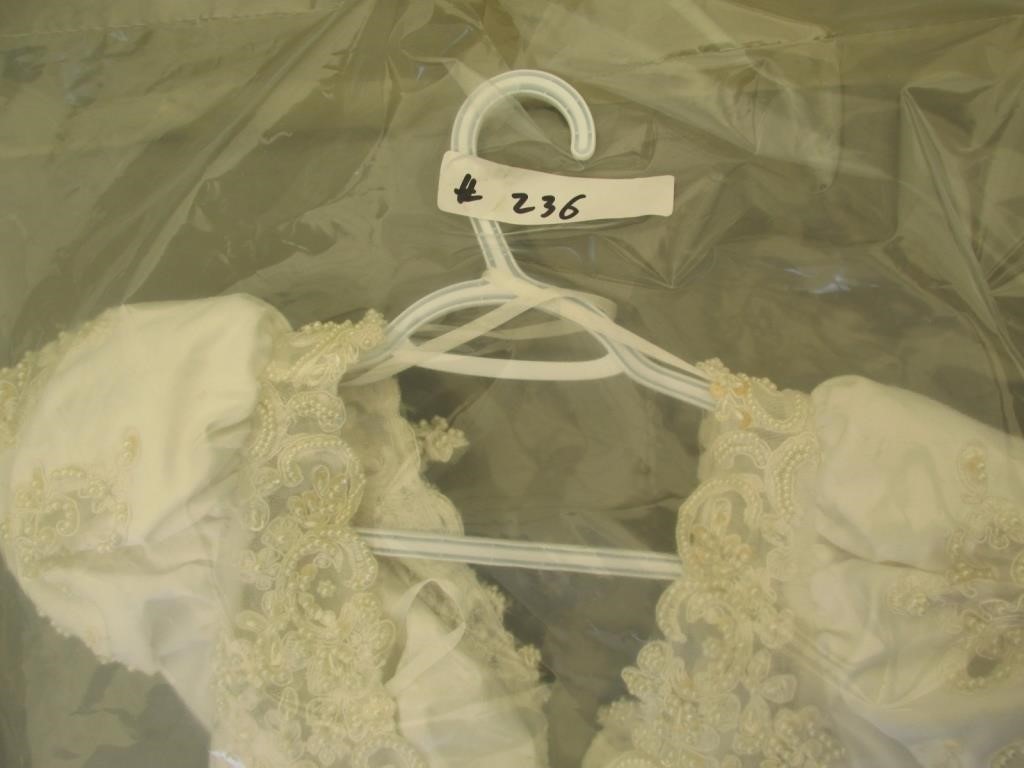 This white wedding dress ('with dirt marks') is among the unusual items for sale at the Winnipeg police unclaimed goods auction.