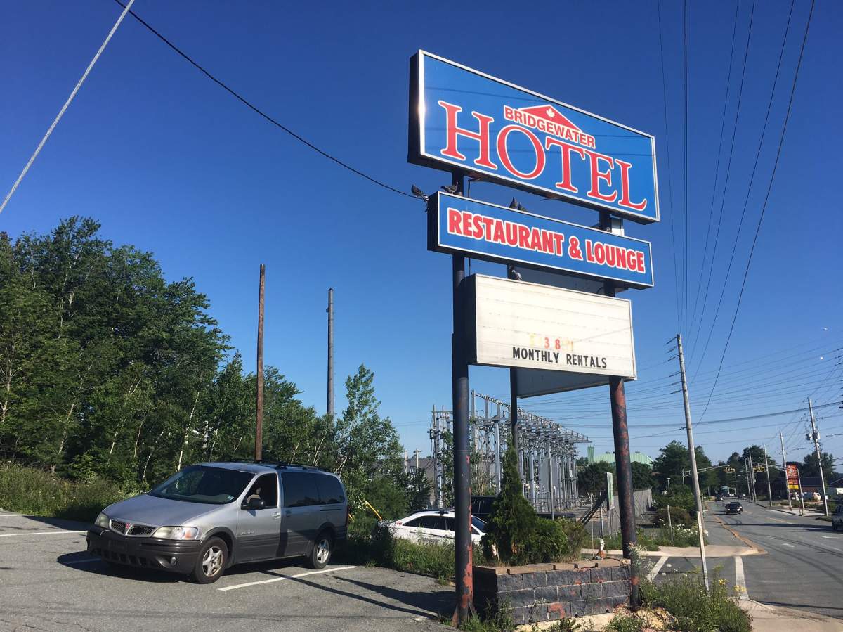 Police search for a suspect after an officer was stabbed at the Bridgewater Hotel on High Street in Bridgewater, N.S., on July 21, 2020.