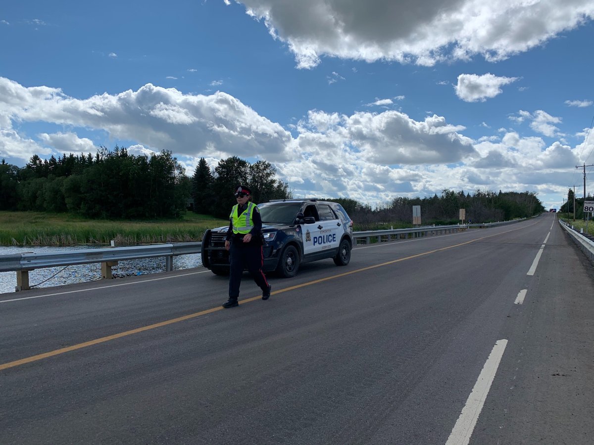 Edmonton police investigate a collision on Ellerslie Road that left two people in critical condition, Saturday, July 18, 2020. 