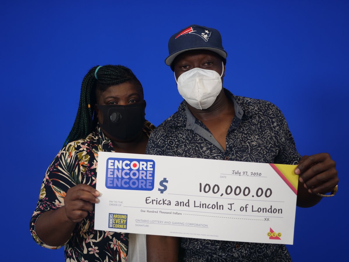 London couple Ericka and Lincoln James (pictured) with their $100,000 cheque after matching the last six of seven Encore numbers in the May 5, 2020 daily Keno draw. 