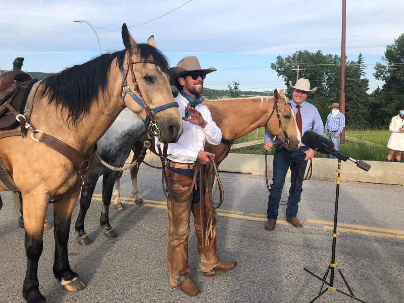 Filipe Masetti Leite (left) and Calgary Stampede President Dana Peers (right) celebrate the cowboy’s eight-year journey.