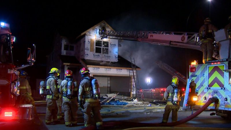 Calgary firefighters battle a blaze at a home under construction in the 100 block of Howse Road Northeast on Wednesday, July 8, 2020. 