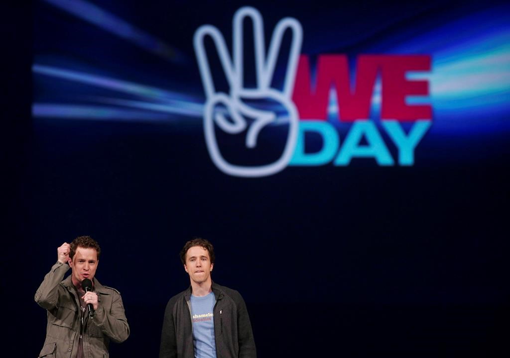 Marc, left, and Craig Kielburger, co-founders of the charity Free the Children, speak at the charity's We Day celebration. On Wednesday Manitoba premier Brian Pallister said the province is reviewing funding for the organization.