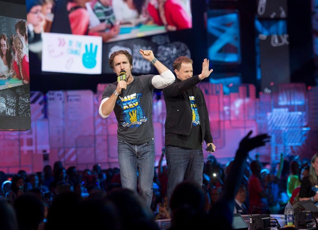 The co-founders of WE Charity are to testify before a House of Commons committee today as part of a parliamentary probe into a $912-million student-volunteer program. Craig Kielburger and Marc Kielburger speak during "We Day" in Toronto on Thursday, Oct. 2, 2014. THE CANADIAN PRESS/Hannah Yoon.