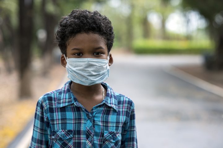 A boy wearing a face mask during the COVID-19 pandemic.