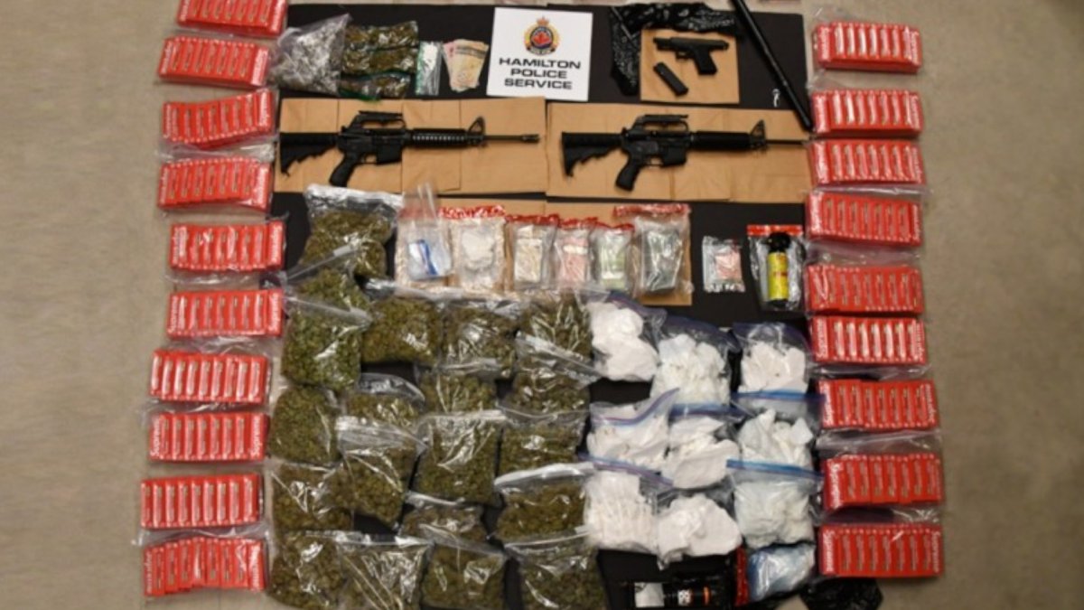 Police have charged five people tied to a drugs and guns investigation at two Hamilton-area resdiences.