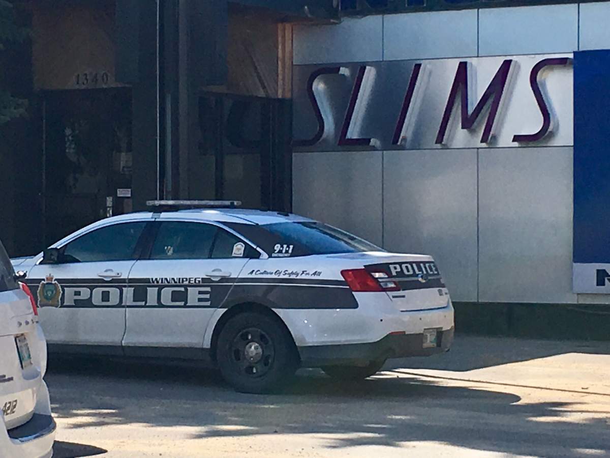 Police investigate at Nygard’s head office in Winnipeg on Thursday, July 16, 2020.