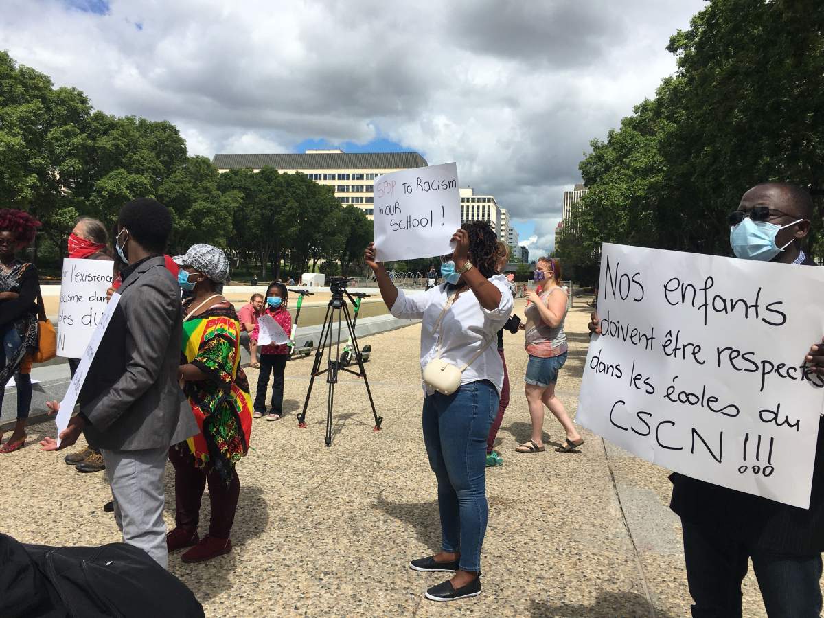 Black parents gathered at the Alberta legislature on Saturday, July 25, 2020.