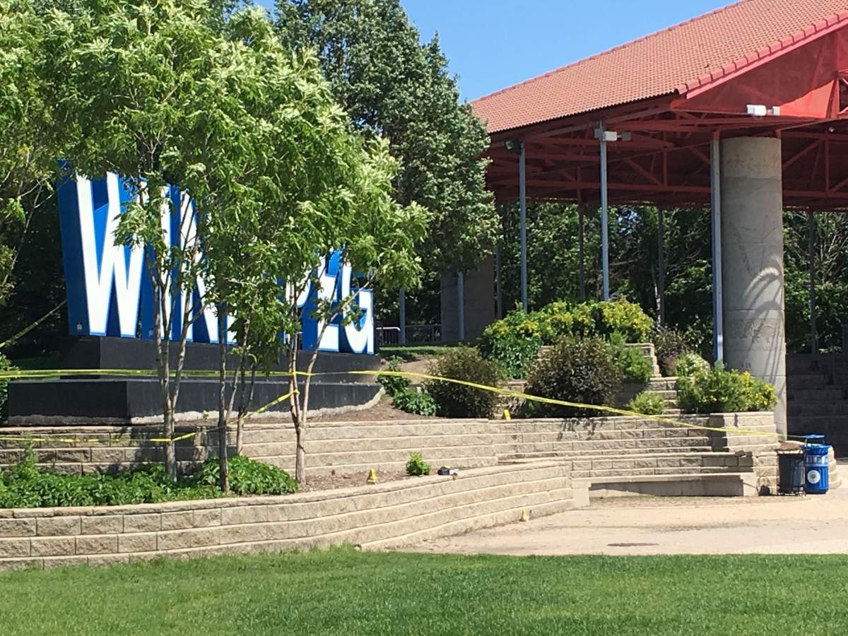 Police investigate after a man was shot and another man was stabbed near the Winnipeg sign at The Forks early Thursday.