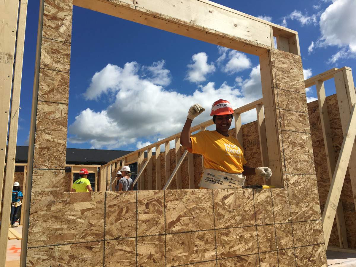 Teruework in the window of her future home thanks to Habitat for Humanity. On Thursday the provincial and federal government announced $3.6 million in funding for housing initiatives, including Habitat for Humanity.