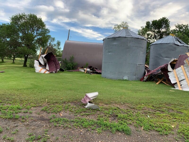 Grain bins were toppled on Corey Schroeder’s farm Monday.