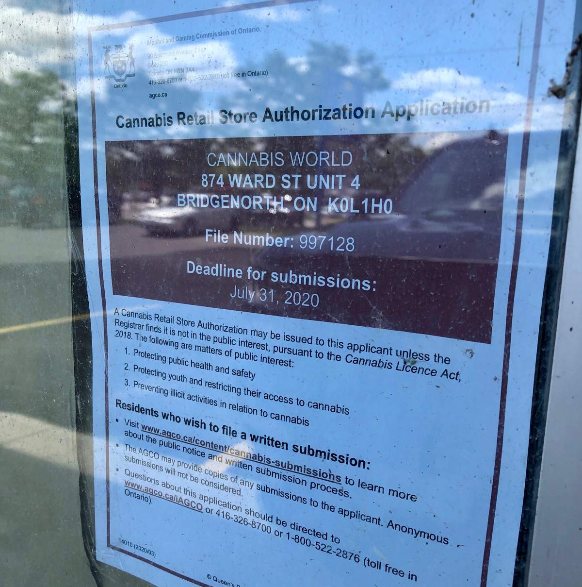 A public notice sign posted in the windows of a Flowertown Cannabis store in Bridgenorth, Ont. on July 23.