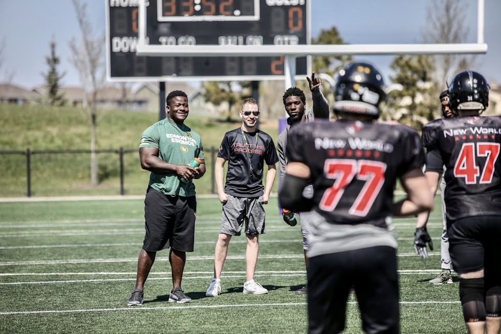 Edmonton sports agent Jason Staroszik (middle).