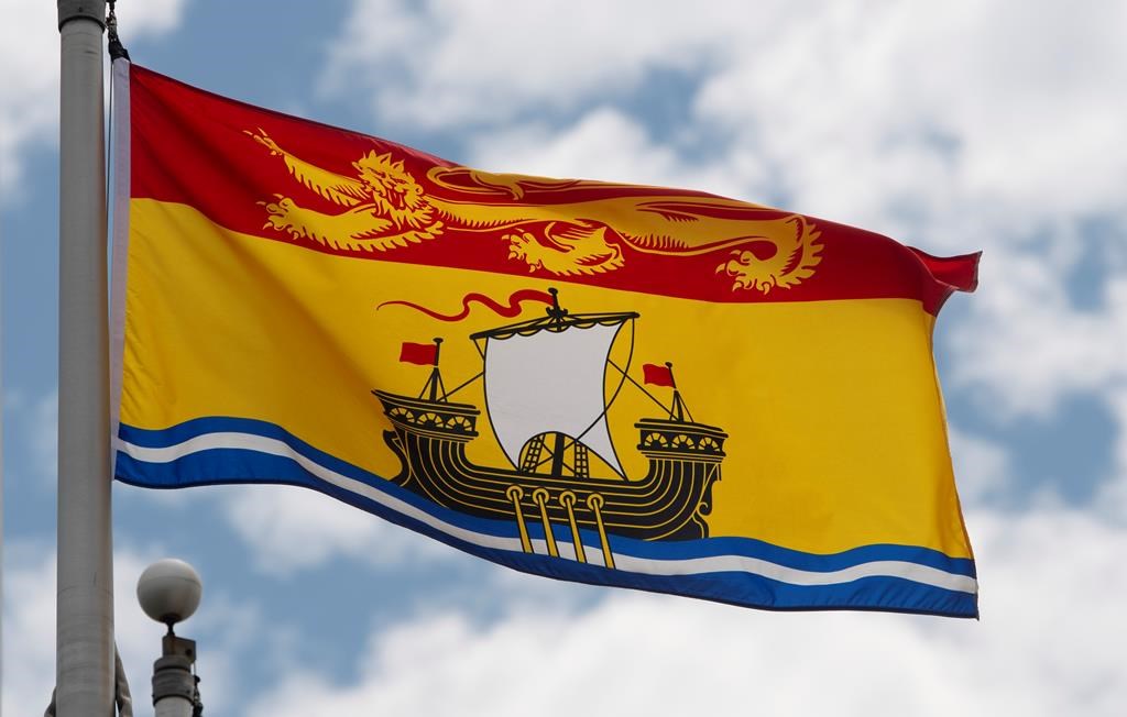 New Brunswick's provincial flag flies on a flag pole in Ottawa, Friday July 3, 2020. THE CANADIAN PRESS/Adrian Wyld.