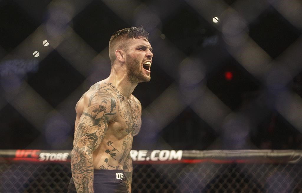 Gavin Tucker celebrates the win over Seungwoo Choi during UFC 240, in Edmonton on Saturday, July 27, 2019. Canadian featherweight Gavin (The Newfoundland Terror) Tucker will face Justin (Guitar Hero) Jaynes on the undercard of a UFC Fight Night card Aug. 8 in Las Vegas. THE CANADIAN PRESS/Jason Franson.