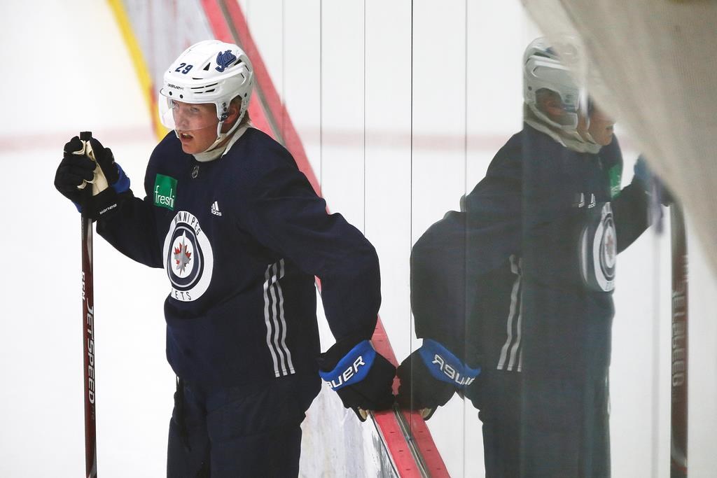 Winnipeg Jets' Patrik Laine (29) looks on during the first day of the Jets NHL summer training camp as the NHL reopens during COVID-19 in Winnipeg, Monday, July 13, 2020. THE CANADIAN PRESS/John Woods.
