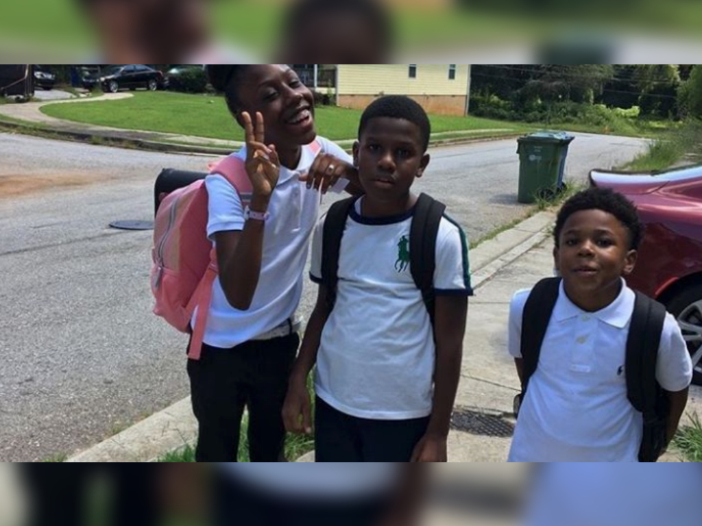 Nine-year-old Jovanni Carson (R) was with his brother and sister when he was shot four times in a drive-by shooting last week in Atlanta.