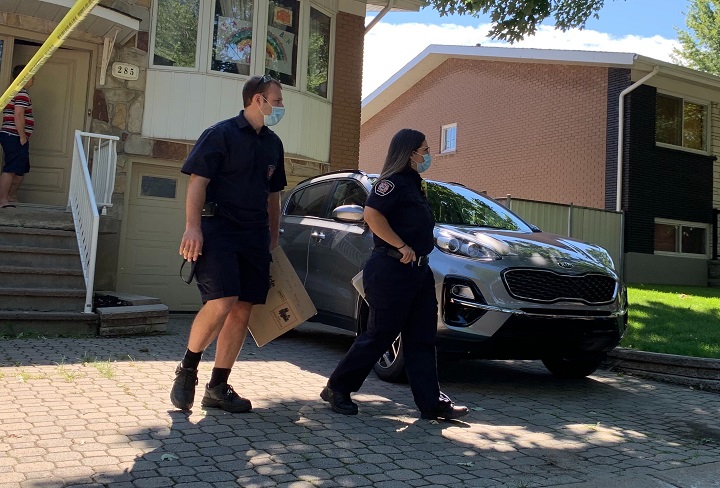 Prevention agents with the Montreal fire department raise awareness about the importance of having a working smoke alarm following a fatal fire in LaSalle. Tuesday, July 28, 2020.