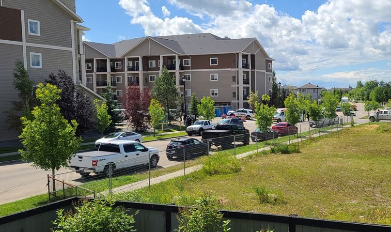 A police scene at an apartment complex at 105 Westhaven Drive in Leduc, Alta., on Friday, July 17, 2020.