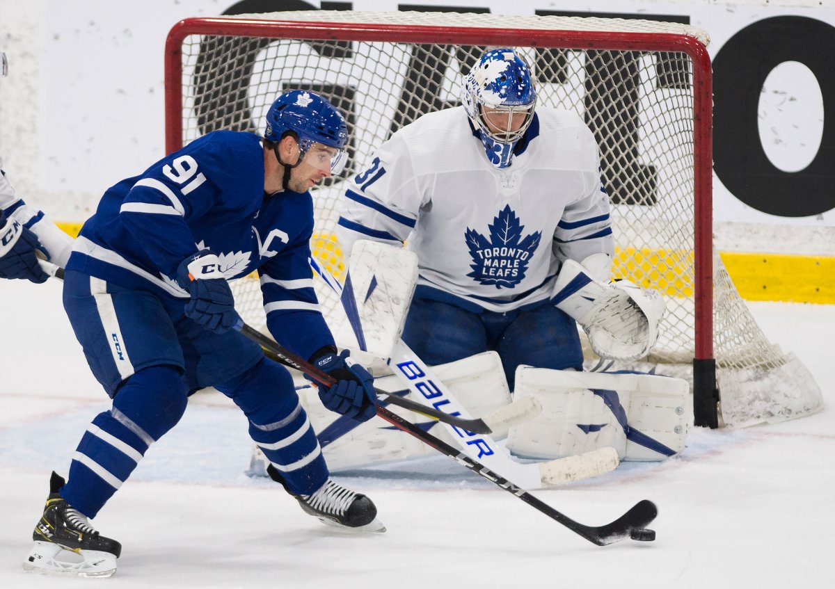 Toronto Maple Leafs centre John Tavares (91) tries to tip the puck past Maple Leafs goaltender Frederik Andersen (31) during first period intrasquad NHL training camp action in Toronto on Thursday, July 23, 2020.