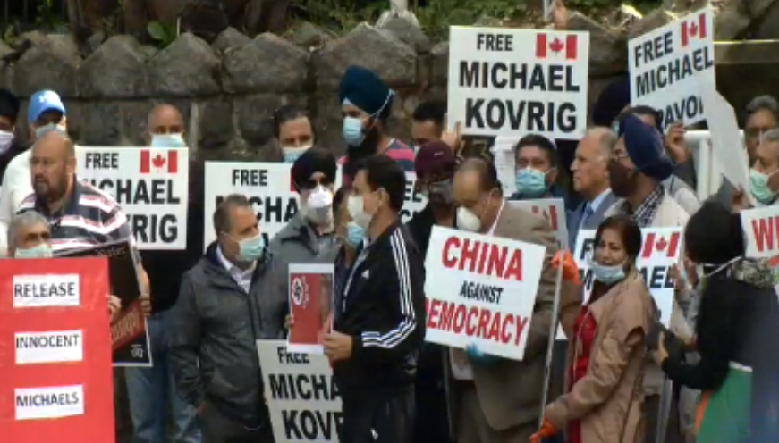 Protesters gather outside the Chinese embassy in Vancouver on Saturday, July 4, 2020. 