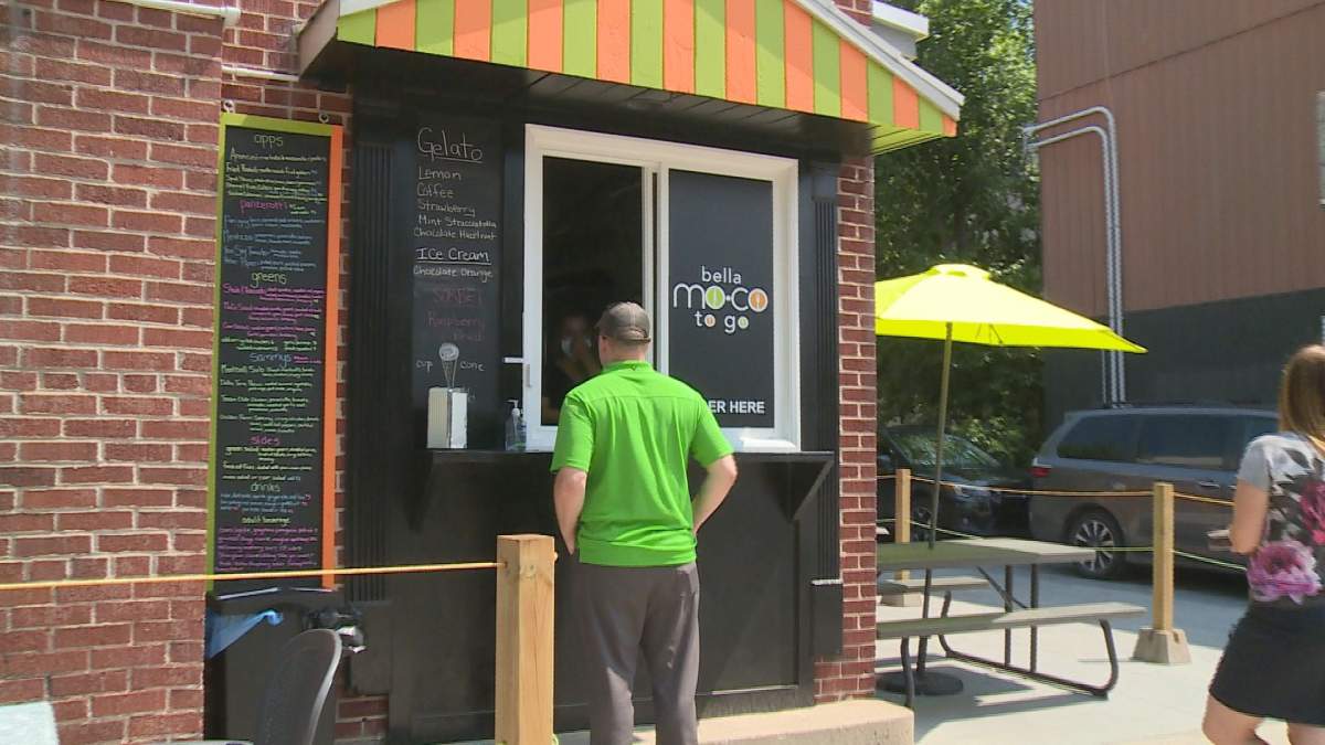 Determined to survive the pandemic, the owners of the rustic Italian themed restaurant converted their office into this take out window and installed a patio.