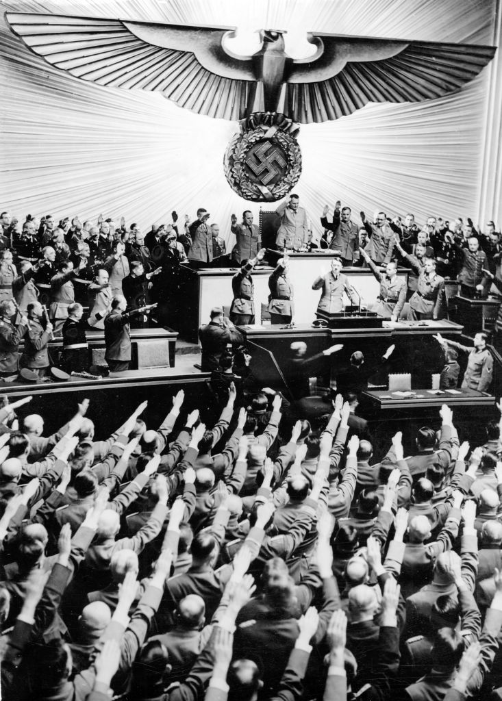 The image from the Nazi Propaganda! shows Reich Chancellor Adolf Hitler greeting the MPs of the Reichstag in the Kroll Opera House in Berlin, Germany, Dec. 11, 1941.