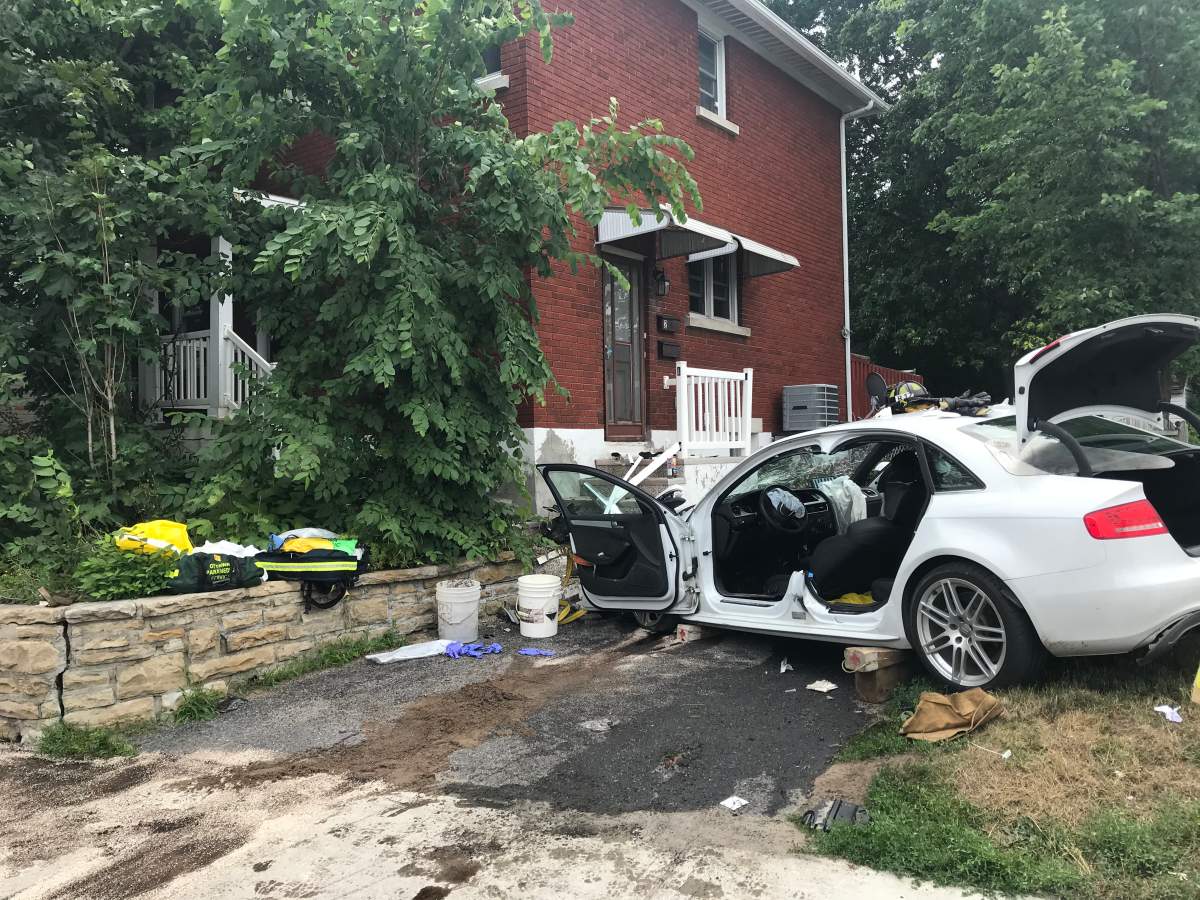 A car crashed into a Carling Avenue home on Monday afternoon. Ottawa fire crews extricated a woman inside the vehicle.