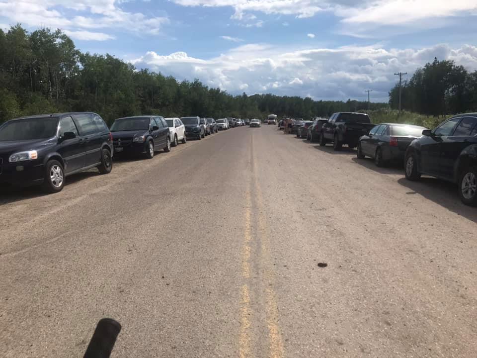 Visitors going to the Pinawa suspension bridge and to float down the Pinawa Channel parking on the road.
