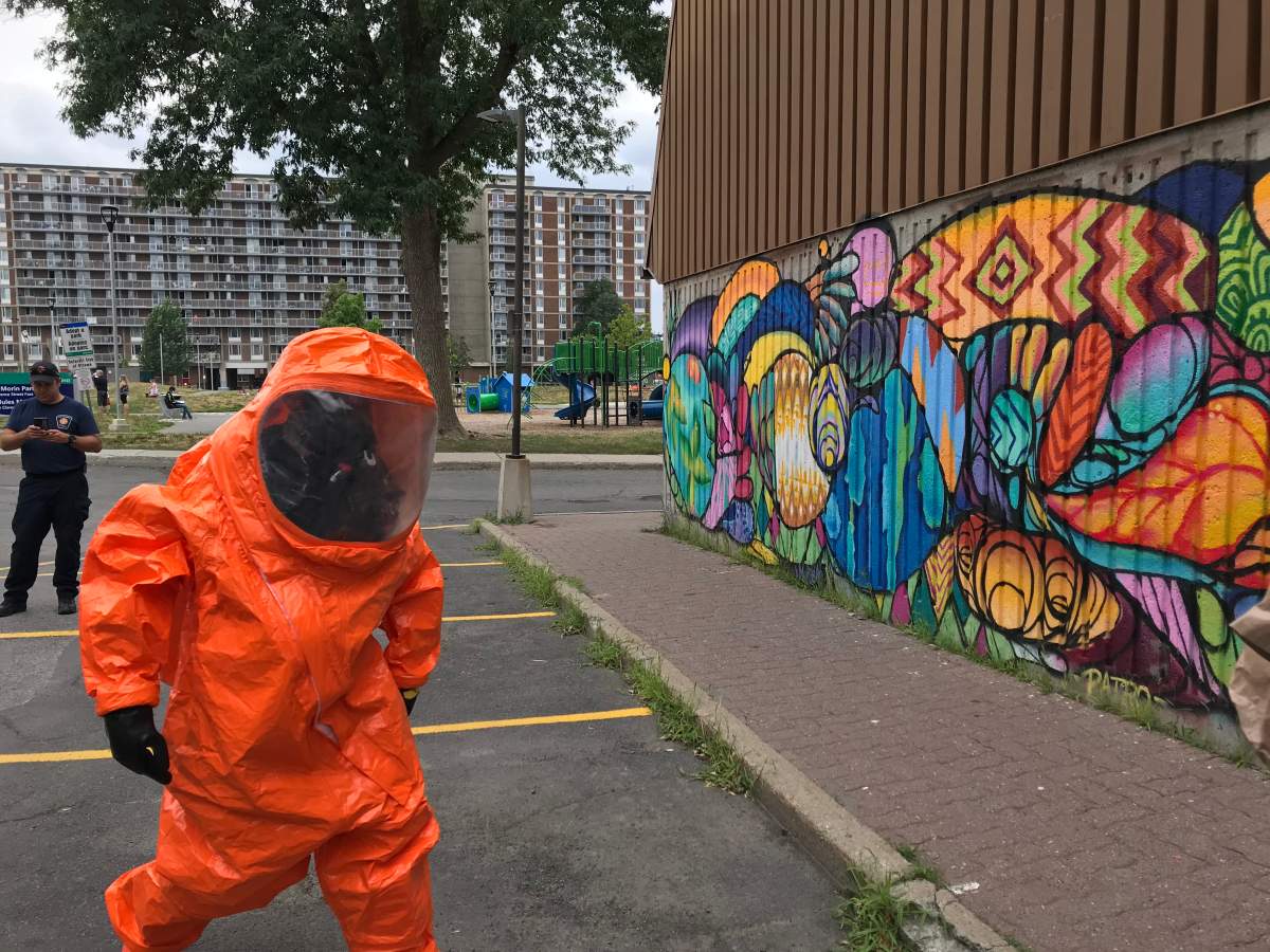 A member of the Ottawa Fire Services' hazmat team heads into Patro d'Ottawa to identify and isolate the source of a chlorine gas leak on Thursday, July 16, 2020.
