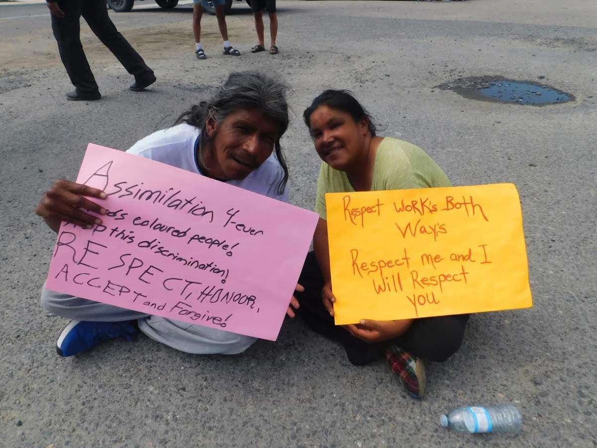 Two people protesting Kenora's proposed loitering bylaw. Kenora council voted against the bylaw this week.