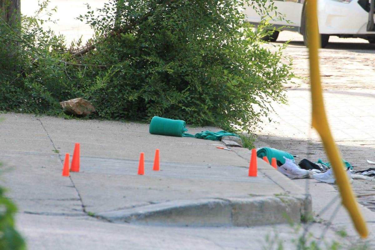 Markers at the scene on Magnus Avenue Tuesday.