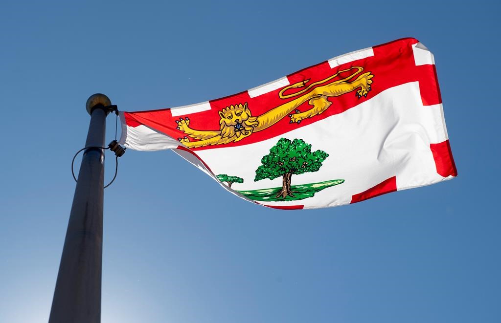 Prince Edward Island's provincial flag flies on a flag pole in Ottawa, Monday, July 6, 2020. Another essential worker has tested positive for COVID-19 on Prince Edward Island. THE CANADIAN PRESS/Adrian Wyld.