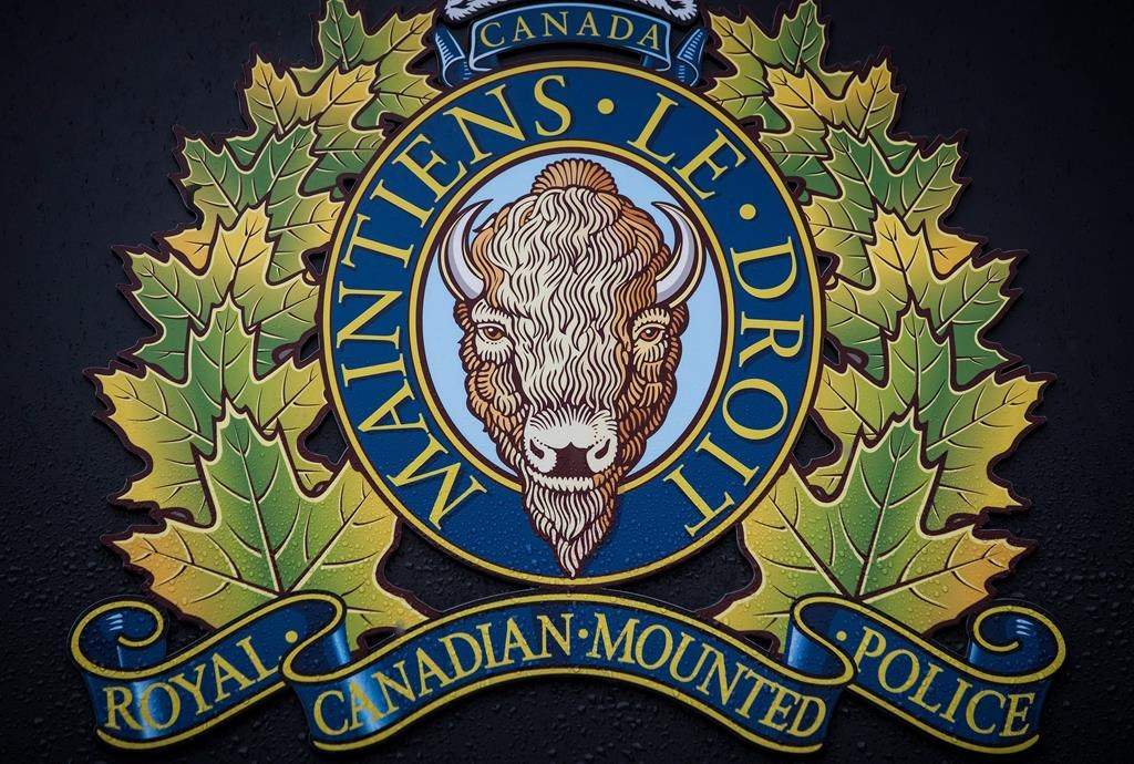 The RCMP logo is seen outside Royal Canadian Mounted Police "E" Division Headquarters, in Surrey, B.C., on Friday April 13, 2018. THE CANADIAN PRESS/Darryl Dyck.