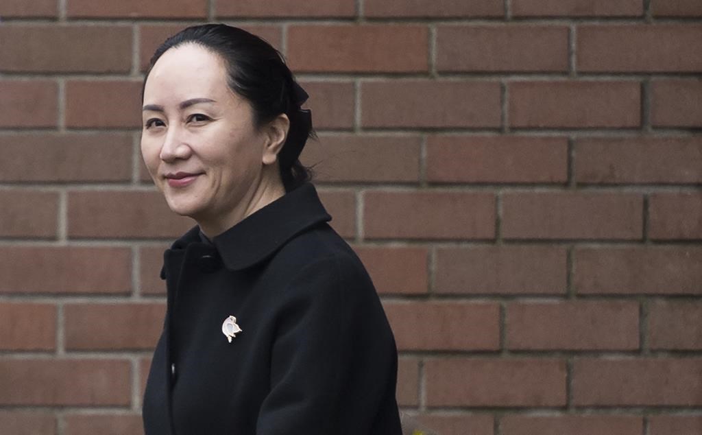 Meng Wanzhou, chief financial officer of Huawei, leaves her home to go to B.C. Supreme Court in Vancouver, Wednesday, January 22, 2020. THE CANADIAN PRESS/Jonathan Hayward