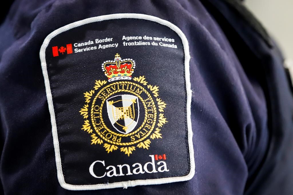 A Canada Border Services Agency (CBSA) patch is seen on an officer in Calgary, Alta., Thursday, Aug. 1, 2019.