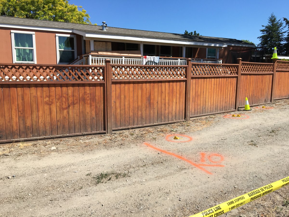 Evidence markers could be seen outside outside a West Kelowna home after an overnight shooting. 