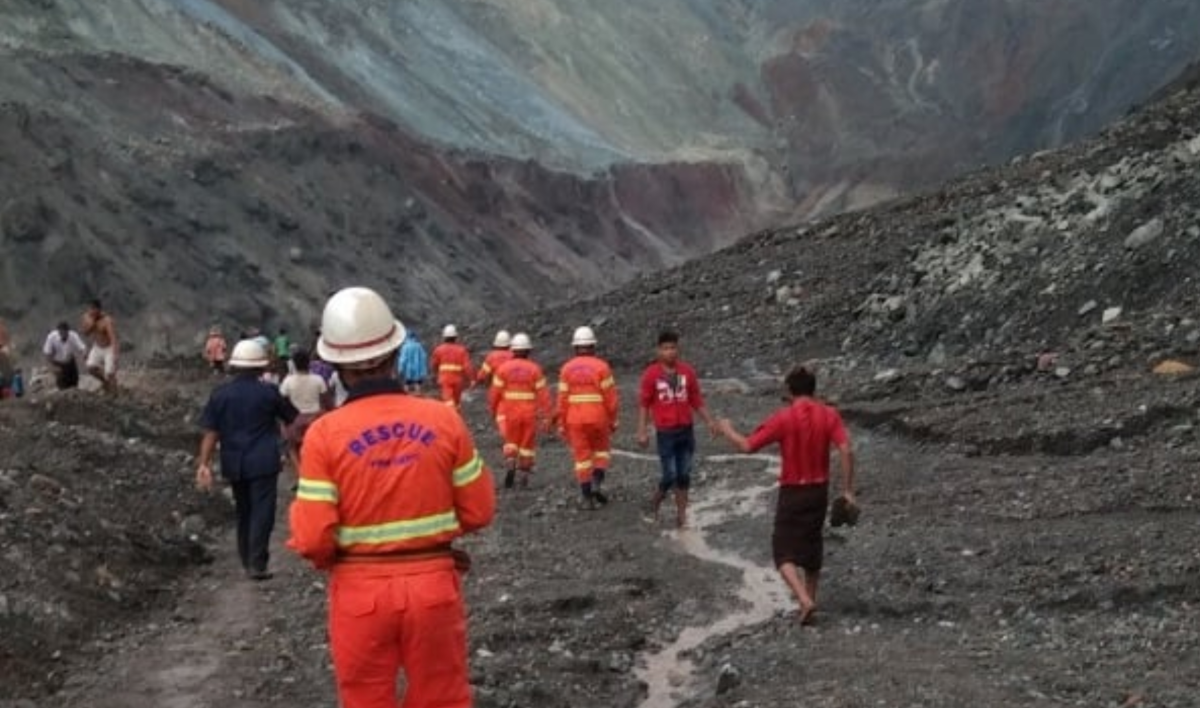 Myanmar fire crews and emergency personnel at the site of a jade mine collapse on July 2, 2020.