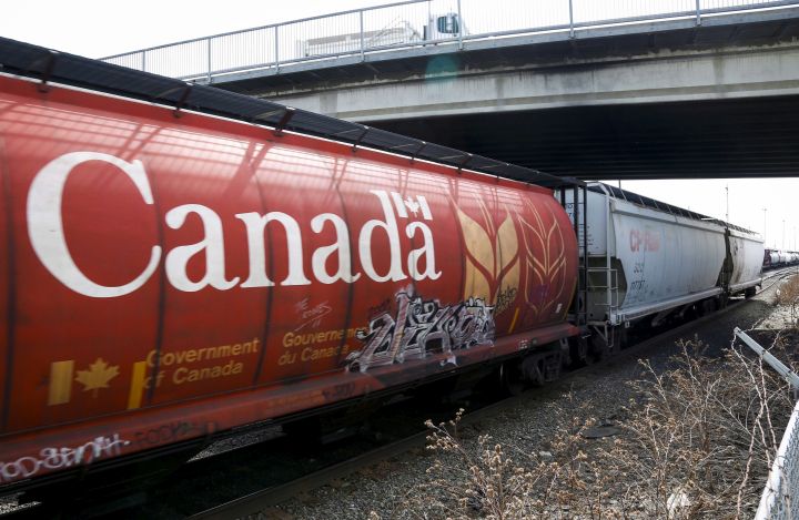 A Canadian Pacific Rail train hauling grain passes through Calgary, Thursday, May 1, 2014. 