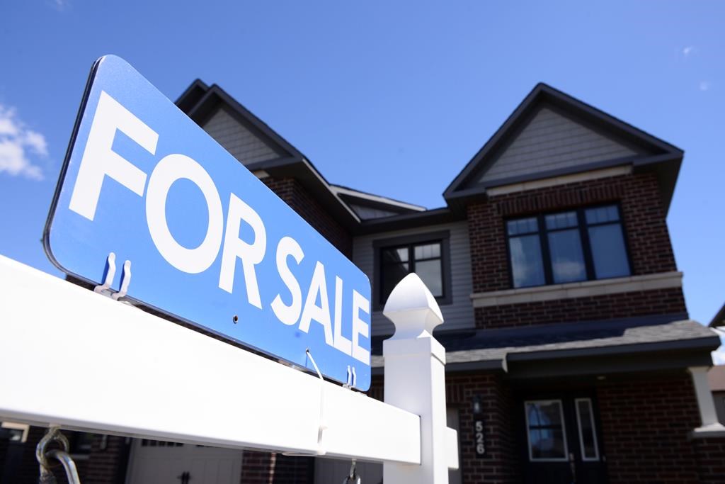 A new home is displayed for sale in a housing development in Ottawa on Tuesday, July 14, 2020. 