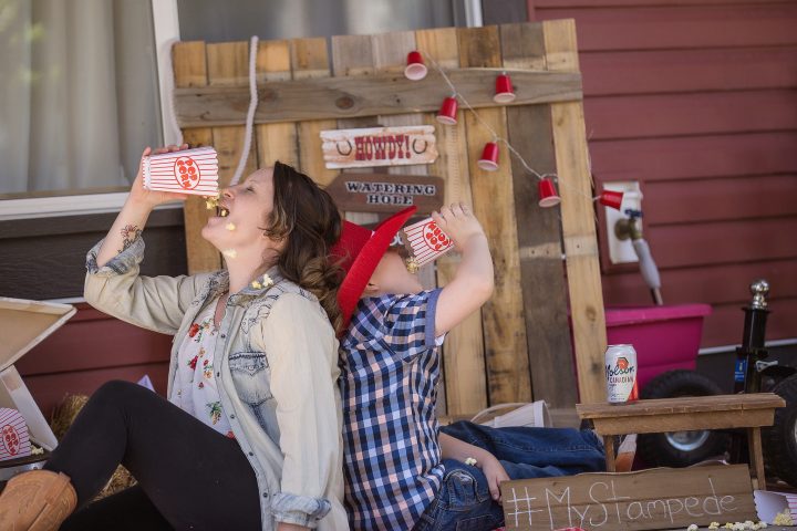 A Calgary family poses for a Stampede themed "Porch-rait" amid COVID-19 physical distancing policies.