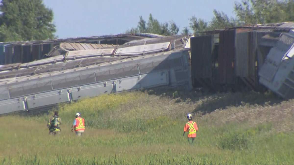 Crews inspect the damage after a train derailed near Deacon's Corner, east of Winnipeg, Thursday.