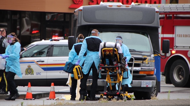 First responders on the scene of a collision between a pedestrian and a TransLink community shuttle on Friday, July 3, 2020. 