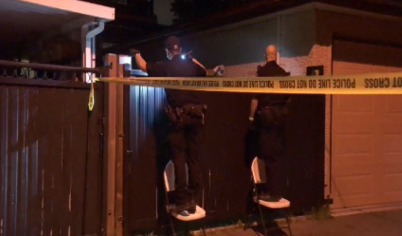 Police search for evidence following a shooting in southeast Vancouver on Wednesday.