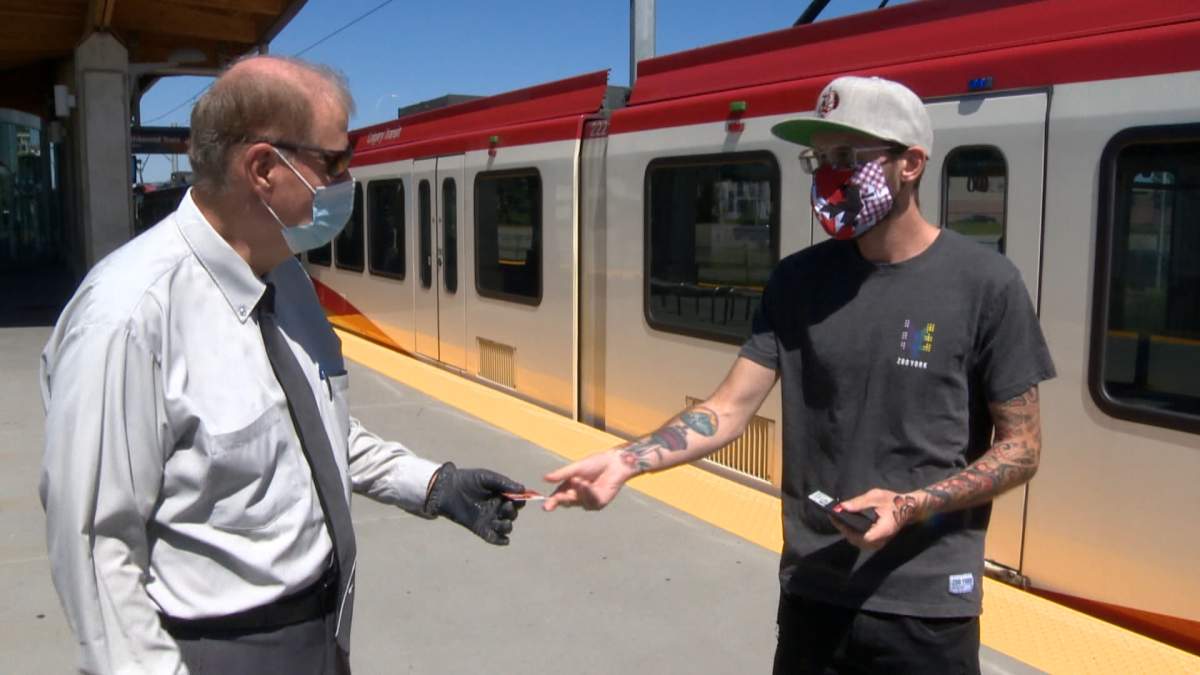 Calgary Transit driver Syd Banks (L) and Grayson Carr (R) 
 reunited to return a lost wallet Monday, July 27, 2020.