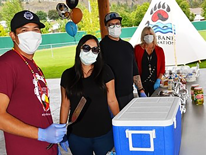 Members of Westbank First Nation's council serving food at the barbecue.